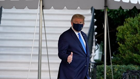 US President Donald Trump gives a thumbs-up as he leaves the White House to go to Walter Reed National Military Medical Centre.