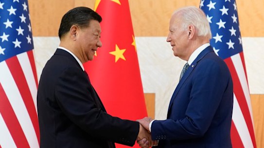 US President Joe Biden and Chinese President Xi Jinping shake hands before their meeting on the sidelines of the G20 summit on Monday.