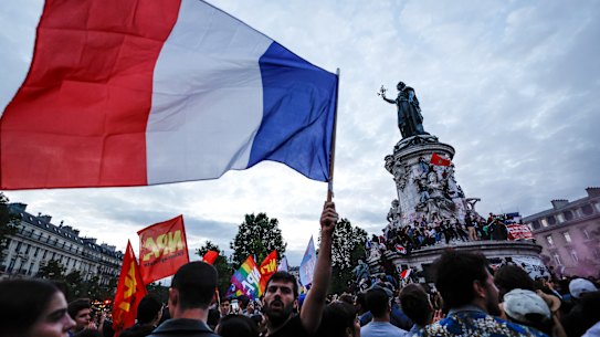 People gather at the Republique Plaza following the second round of French legislative elections.