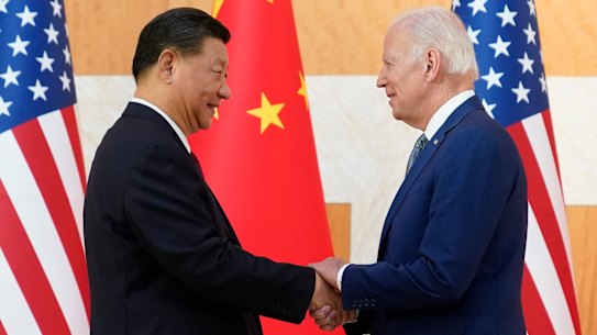 Chinese President Xi Jinping and US President Joe Biden shake hands at the G20 last year.