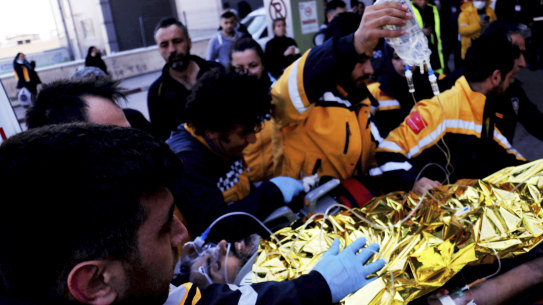 Rescue workers pull out Samir Muhammed Accar, a Syrian migrant, from a collapsed building in Antakya, Turkey, on Saturday, the 13th day of rescue operations.
