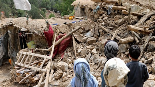 Afghan children stand near a house that was destroyed in an earthquake in the Spera District of the southwestern part of Khost Province, Afghanistan, Wednesday, June 22, 2022. A powerful earthquake struck a rugged, mountainous region of eastern Afghanistan early Wednesday, killing at least 1,000 people and injuring 1,500 more in one of the country’s deadliest quakes in decades, the state-run news agency reported.