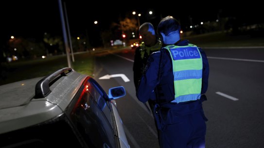 Superintendent Andy McKee and his partner Sergeant Richard Clayton pull over a motorist in the early hours of August 6.