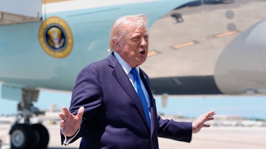 President Donald Trump speaks to reporters before boarding Air Force One in Florida.