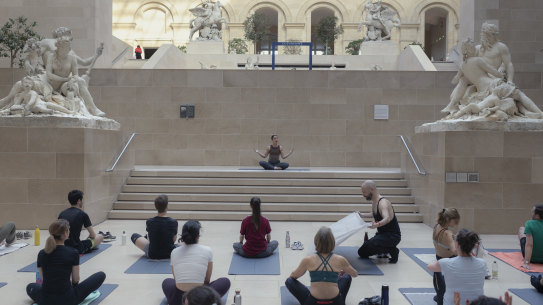 A yoga class, held before crowds arrive, in The Louvre Museum in Paris.
