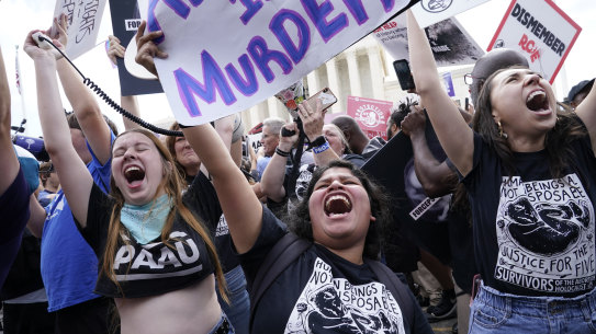 People celebrate the Supreme Court’s decision to end the constitutional protections for abortion.