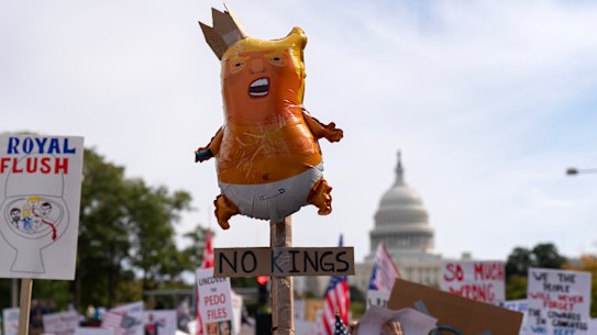 Demonstrators rally on Pennsylvania Avenue during a No Kings protest in Washington.