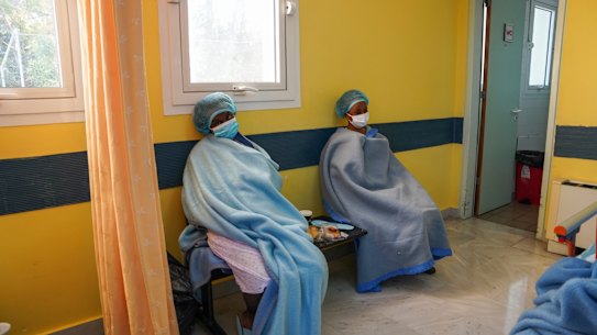 Migrants at a hospital after the deadly sinking of a boat.