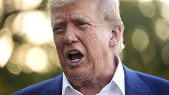 President Donald Trump speaks with reporters before boarding Marine One