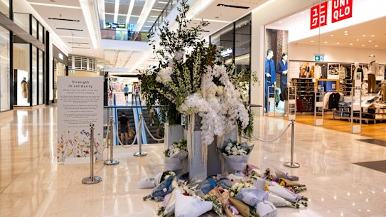 Floral tributes mark the anniversary of Bondi Junction Westfield stabbing.