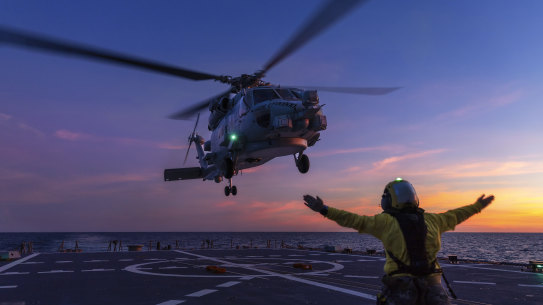 Australia has protested to Beijing that a Chinese fighter jet endangered an Australian navy helicopter over international waters.