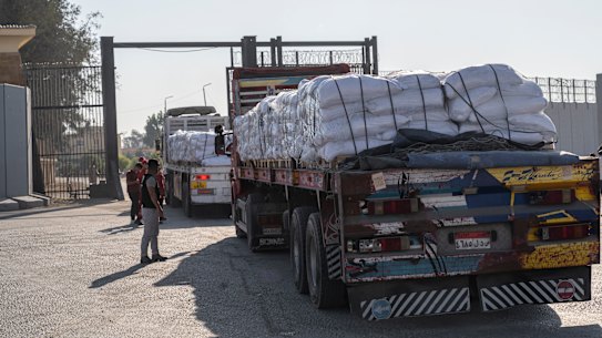 RAFAH, EGYPT - JULY 27: Trucks carrying aid enter Gaza through the Rafah border crossing on July 27, 2025 in Rafah, Egypt. Israel announce a “tactical pause” in fighting in some parts of Gaza, including near the Rafah crossing, from 10 AM to 8 PM today to allow for shipments of humanitarian aid, as concern grows about a deepening hunger crisis in the Palestinian territory. (Photo by Ali Moustafa/Getty Images)