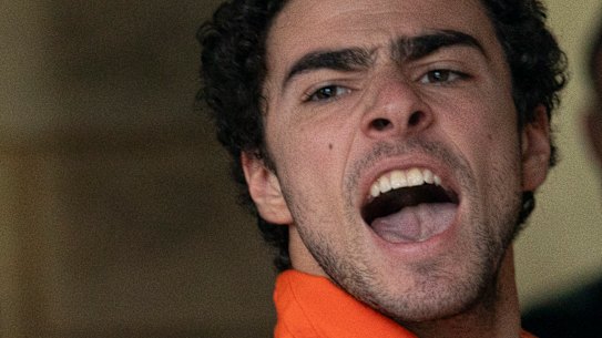 Suspect Luigi Mangione yells as he is taken into the Blair County Courthouse in Hollidaysburg, Pennyslvania.