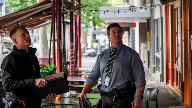 Police on New Year’s Day at the scene of the Carlton stabbing.