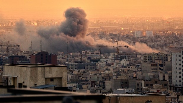 Smoke rises during a US-Israeli attack on Tehran. 