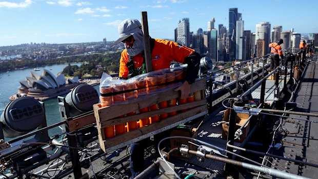 Workers are spaced five to ten metres apart to pass equipment in a “production line”.