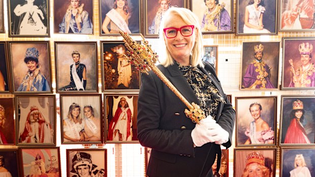 Former Melbourne lord mayor Sally Capp with a Moomba sceptre and portraits of Moomba monarchs.