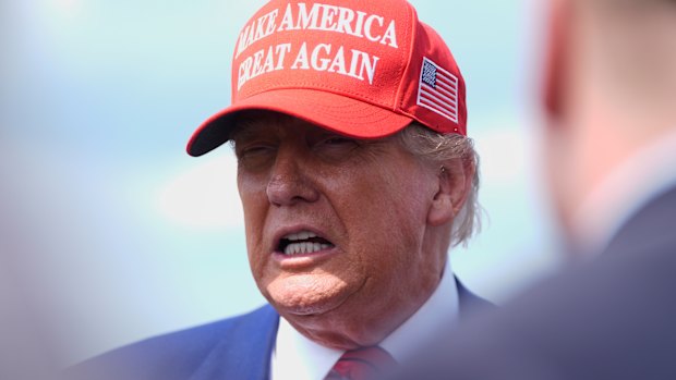 US President Donald Trump speaks with reporters upon arriving in New Jersey on Friday.
