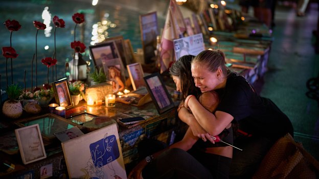 In Tel Aviv on Tuesday, Yuval Miranda and Katya Emelianova cry as they embrace at a memorial marking the two-year anniversary of the deadly October 7 Hamas attack on Israel.