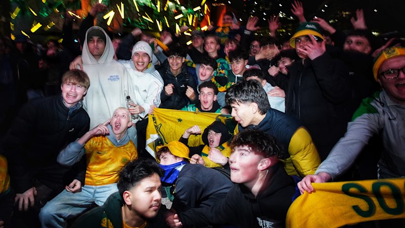 ‘Where the true believers come’: Fans and flares descend on Federation Square for Socceroos