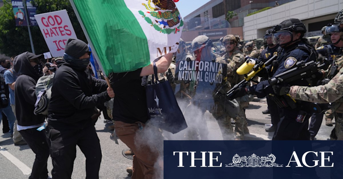 Tear gas fired as troops clash with protesters in Los Angeles after Trump ...