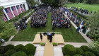 President Donald Trump, centre, stood with Judge Amy Coney Barrett at the news conference to announce Barrett as his nominee to the Supreme Court, in the Rose Garden at the White House.