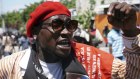 A protester demands the resignation of President Jovenel Moise in Port-au-Prince last September. Moise was assassinated in his house last week. 