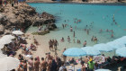 Tourists at Blue Lagoon in Comio, Malta. As European economies open for the tourist season, there are concerns about the deltas wave.