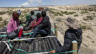 Immigrants ride atop a freight train while en route to the US-Mexico border near Ciudad Juarez, Mexico.