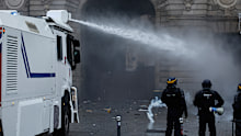 Protests in Paris began peacefully, but became more tense as the day wore on, with police using water cannons and tear gas.