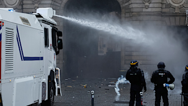 Protests in Paris began peacefully, but became more tense as the day wore on, with police using water cannons and tear gas.