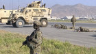 Secured for now. US soldiers stand guard along a perimeter at the international airport in Kabul.