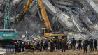 Thai rescue teams work to extract people trapped in the collapsed building.