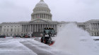 A snowplough clears the area as snow blankets Capitol Hill ahead of a joint session of Congress to certify the votes from the Electoral College in the presidential election in Washington.