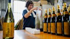 Packing bottles of Awamori in an Okinawa distillary.