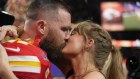 Taylor Swift kisses Kansas City Chiefs tight end Travis Kelce after the NFL Super Bowl. 