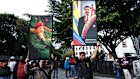 Supporters of Nicolás Maduro and late Hugo Chavez hold posters with their images after the US intervention in Venezuela.