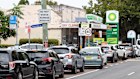 Long queues form at a Sydney BP petrol station on Monday.