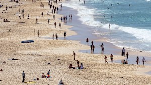 Some workers are taking advantage of working from home on a Friday, and heading to the beach.