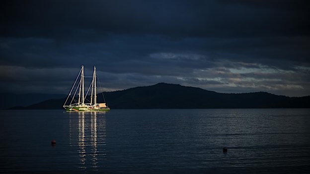The Greenpeace Rainbow Warrior is anchored off the coastline near Kioa island.