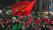 Pro-government demonstrators gather at a square in Tehran, Friday, July 17, 2026.