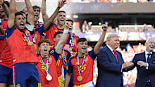 Spain players cheer alongside President Donald Trump and FIFA President Gianni Infantino.