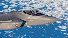 A Danish Air Force F-35 aircraft patrols over the east coast of Greenland.