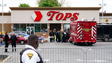 Investigators work the scene of a shooting at a supermarket, in Buffalo, NY. 