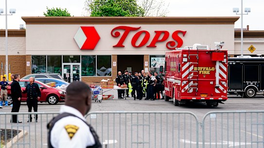 Investigators work the scene of a shooting at a supermarket, in Buffalo, NY. 