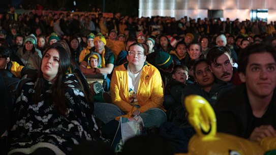 Matildas fans watch the Australia v Sweden game at Tumbalong Park.