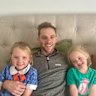 Injured jockey Declan Bates recovers at home with daughters Molly, left, and Saoirse.