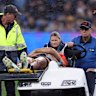 Joseph-Aukuso Suaalii of the NSW Waratahs is taken off the field. 