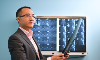 Dr Michael Wong educates patients about solutions to long-term spinal pain.