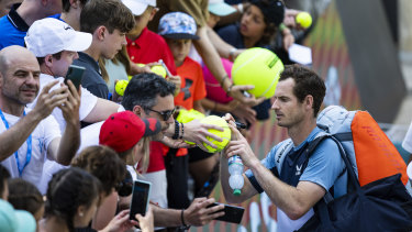 Andy Murray signs autographs for the fans after his win over Nick Kyrgios.